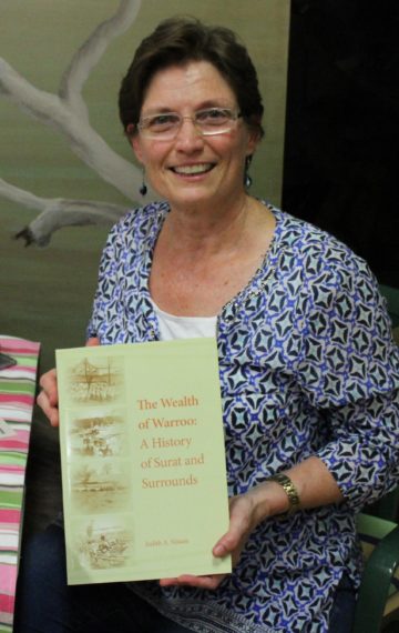 Judith Nissen holding her book cover